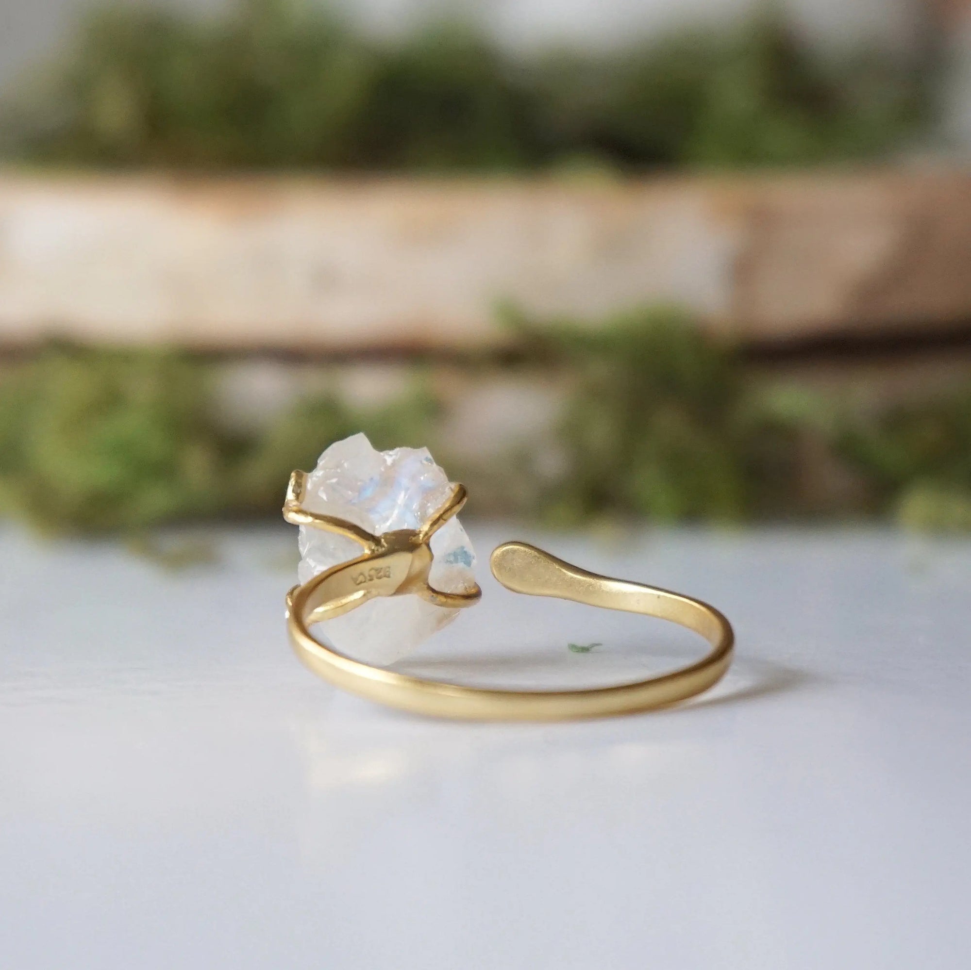 Back view of adjustable ring band in 14k gold vermeil showing open adjustable fit and handcrafted finish on rainbow moonstone ring.