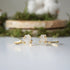 Two adjustable raw rainbow moonstone rings showing natural variation in stone size, shape, and moonstone flash in gold vermeil settings.