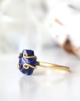 Left-side detail of adjustable raw sapphire ring showing the handcrafted gold vermeil artisan setting