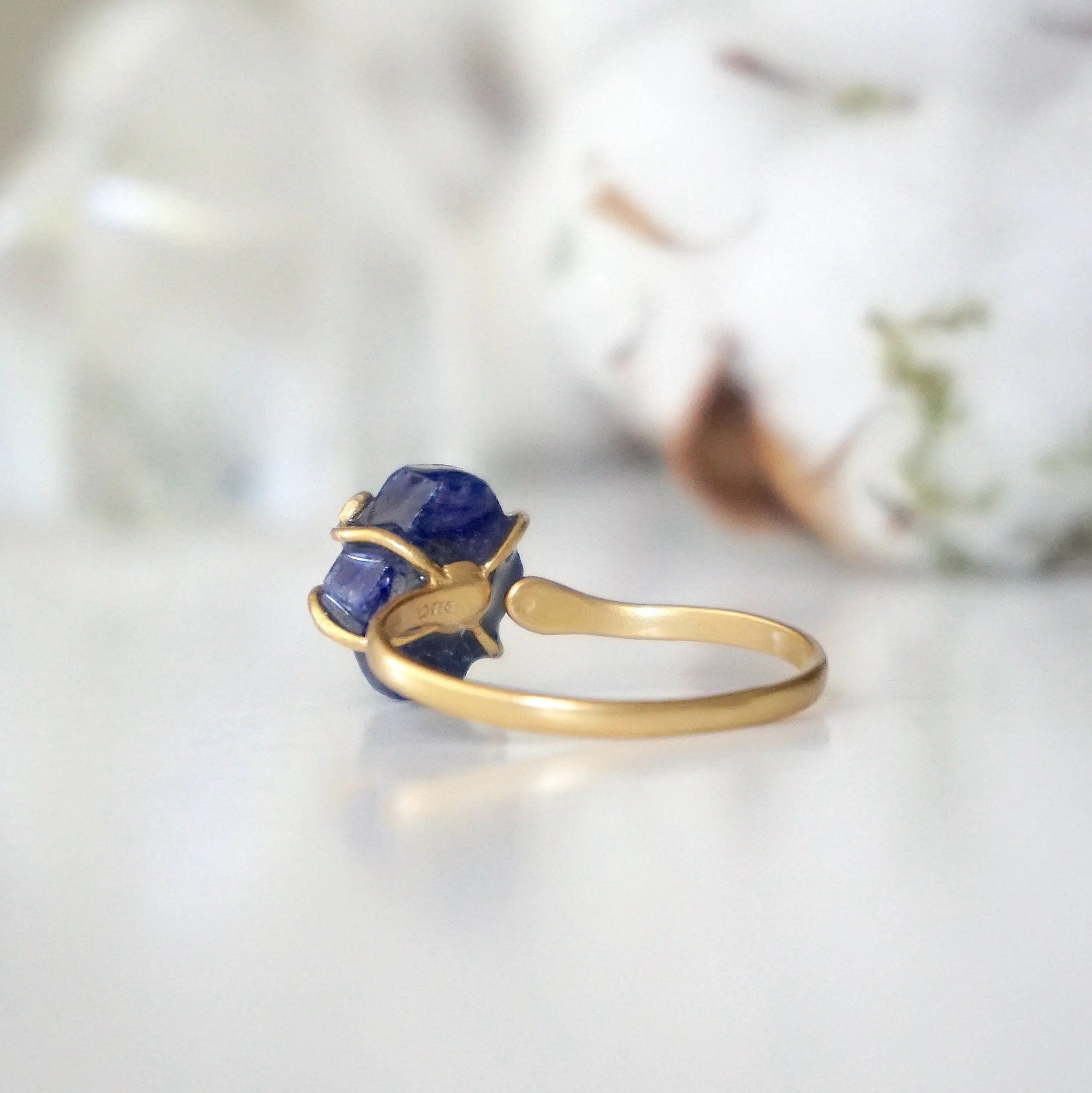 Back view of adjustable raw sapphire ring showing the gold vermeil band and adjustable artisan design