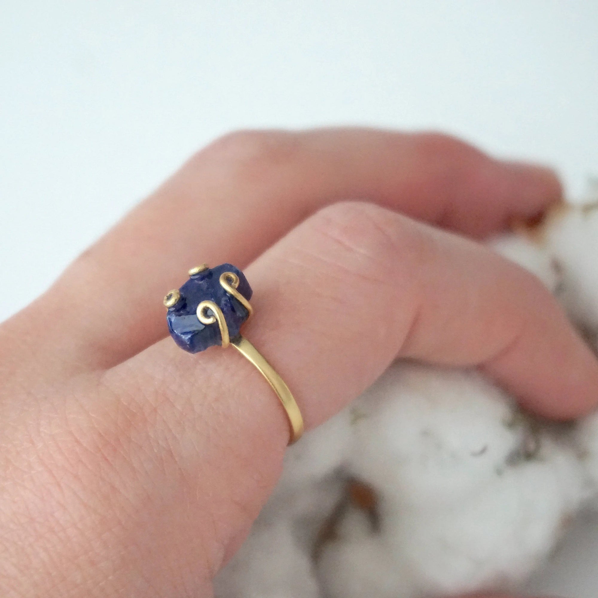 Adjustable natural sapphire ring on a woman’s hand — gold vermeil artisan setting and September birthstone jewelry by Designs by Nature Gems