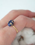 Adjustable natural sapphire ring on a woman’s hand — gold vermeil artisan setting and September birthstone jewelry by Designs by Nature Gems