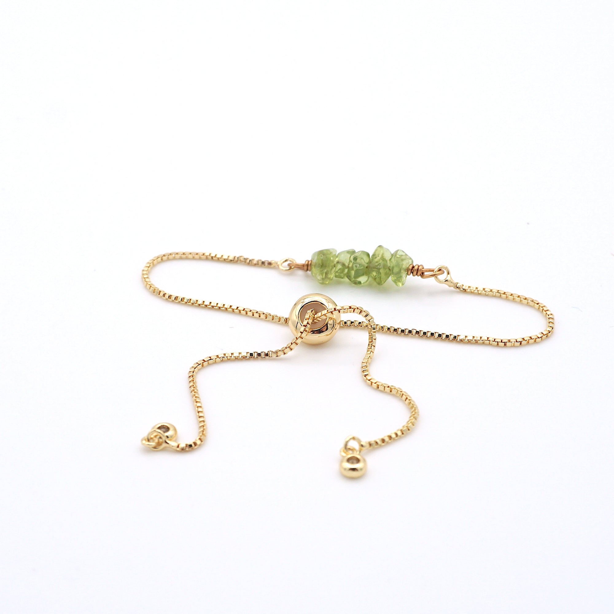 Adjustable slider closure detail on natural peridot bracelet, easy fit mechanism for all wrist sizes