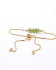 Adjustable slider closure detail on natural peridot bracelet, easy fit mechanism for all wrist sizes