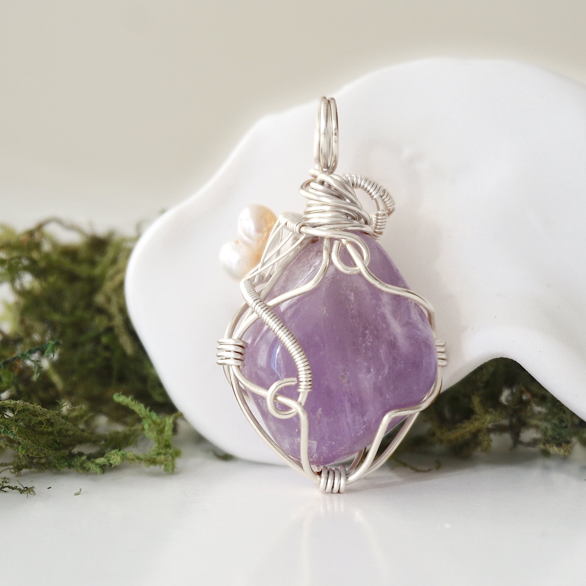 Back detail of silver wire wrapped amethyst and freshwater pearl pendant necklace, handcrafted gemstone jewelry