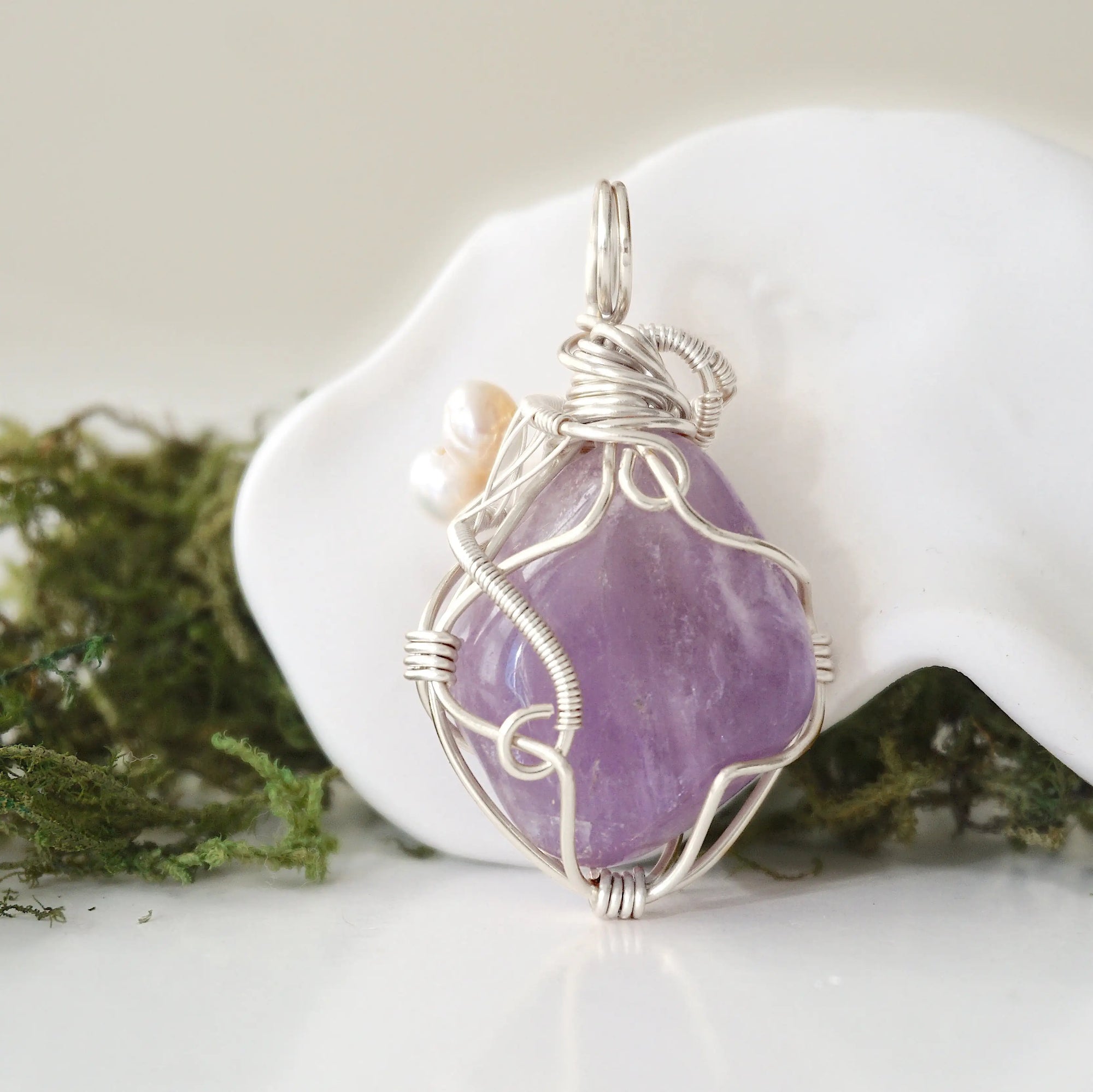 Back detail of silver wire wrapped amethyst and freshwater pearl pendant necklace, handcrafted gemstone jewelry