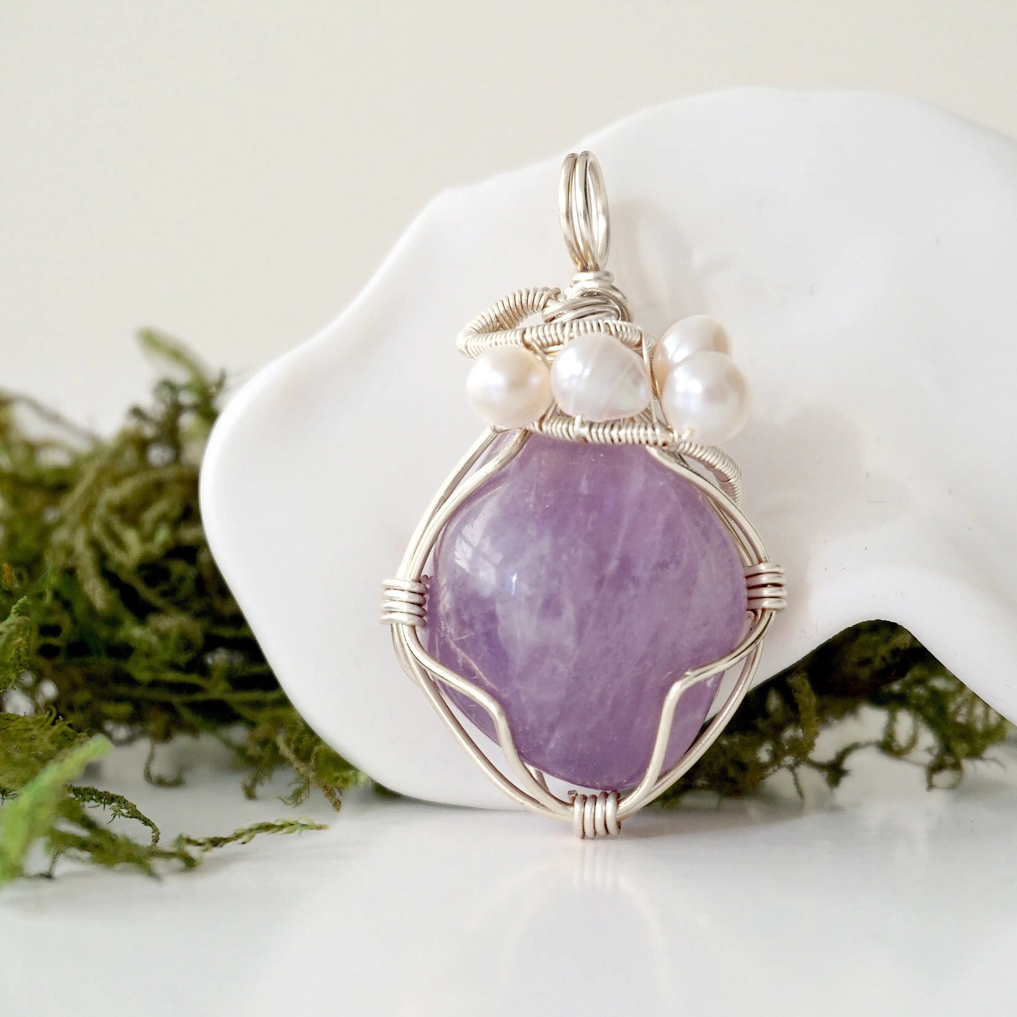 Detailed front view of silver wire wrapped amethyst and freshwater pearl pendant, unique artisan necklace