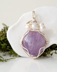 Detailed front view of silver wire wrapped amethyst and freshwater pearl pendant, unique artisan necklace
