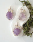 Three silver wire wrapped amethyst and freshwater pearl pendants showing natural stone variation, artisan jewelry for women