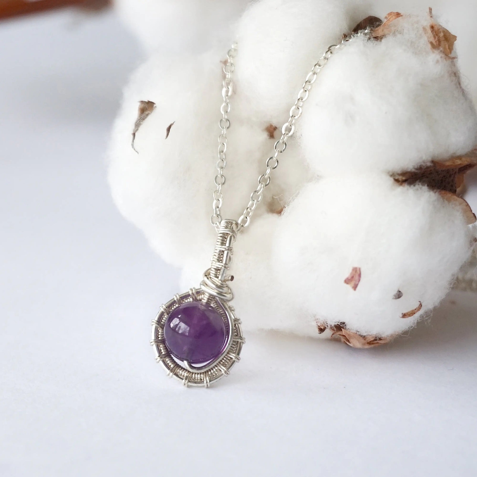 Back side angle of women’s amethyst necklace, 8mm amethyst bead, artisan silver plated copper wire wrap