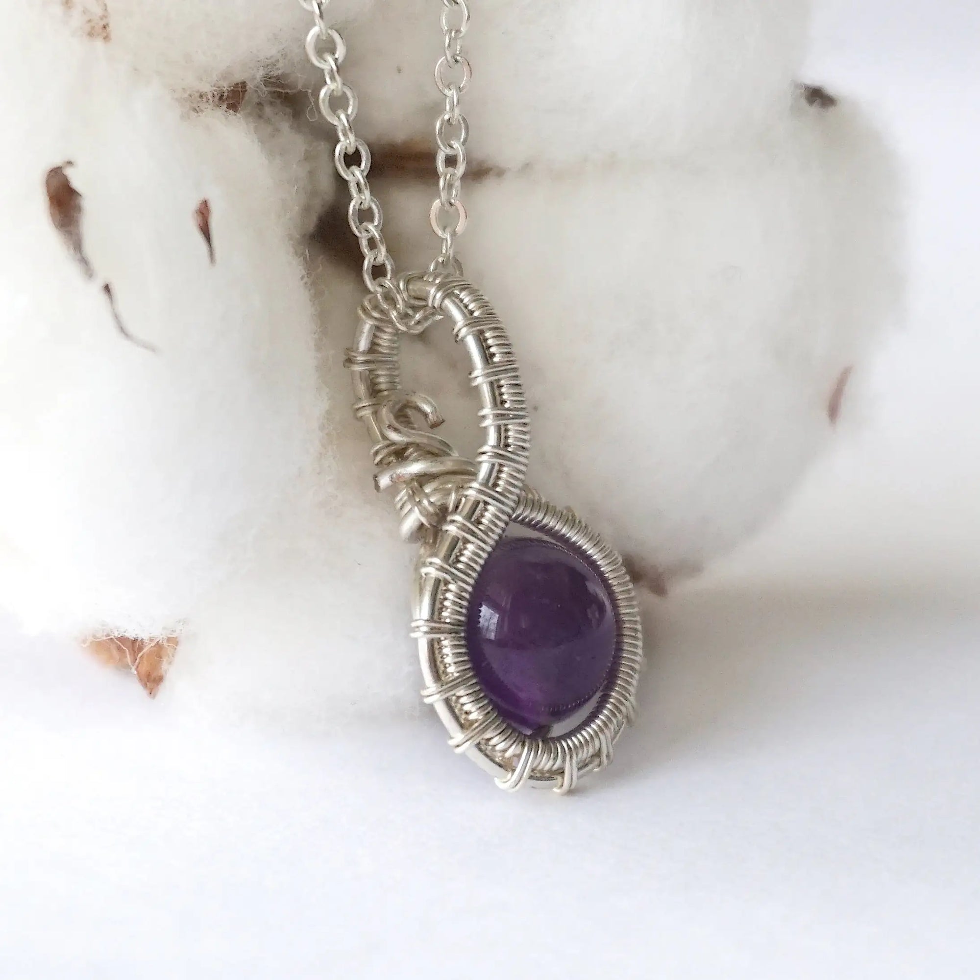 Right side angle of women’s amethyst necklace, 8mm amethyst bead, artisan silver plated copper wire wrap