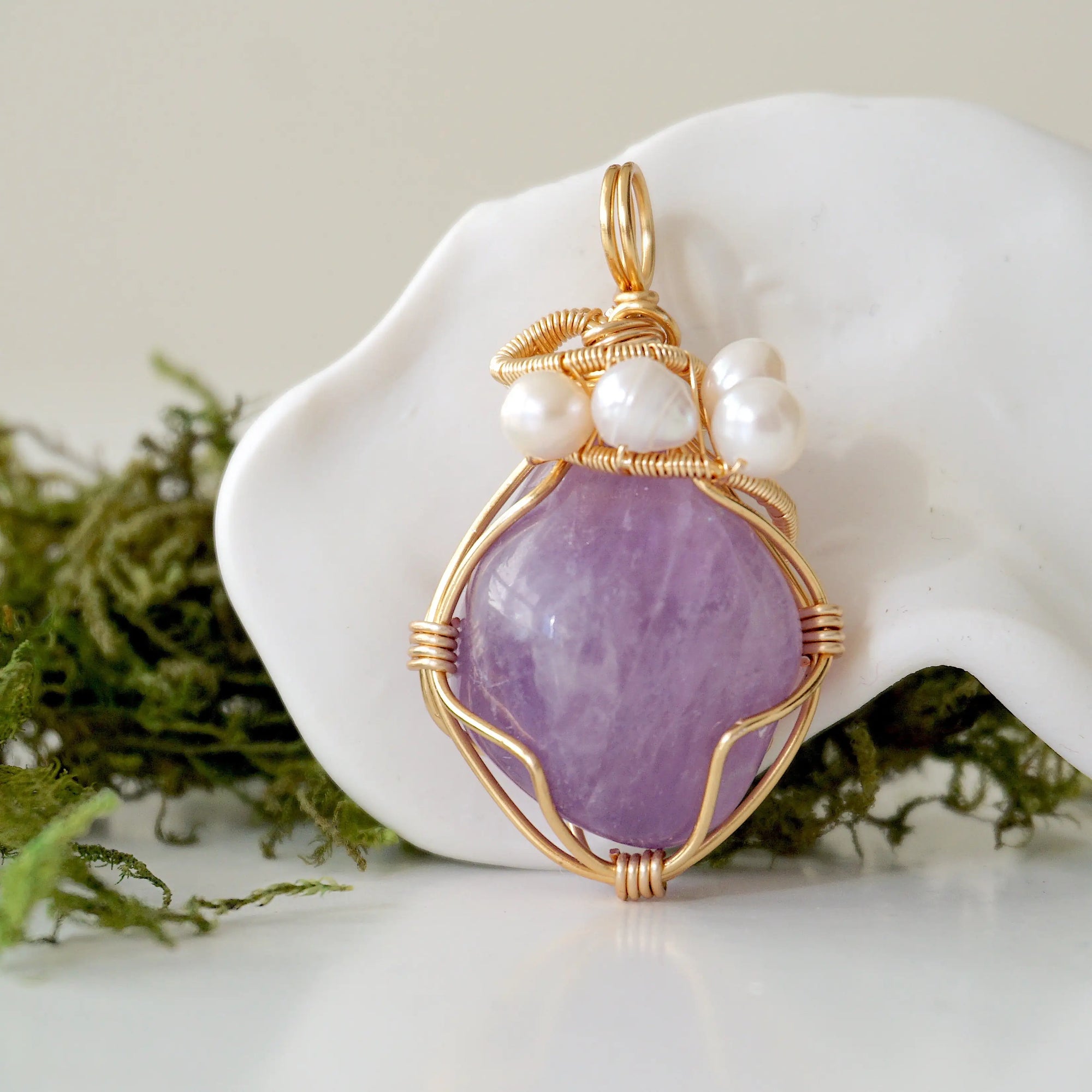 Detailed front angle of amethyst and freshwater pearl pendant, gold wire wrapped, handcrafted gemstone jewelry