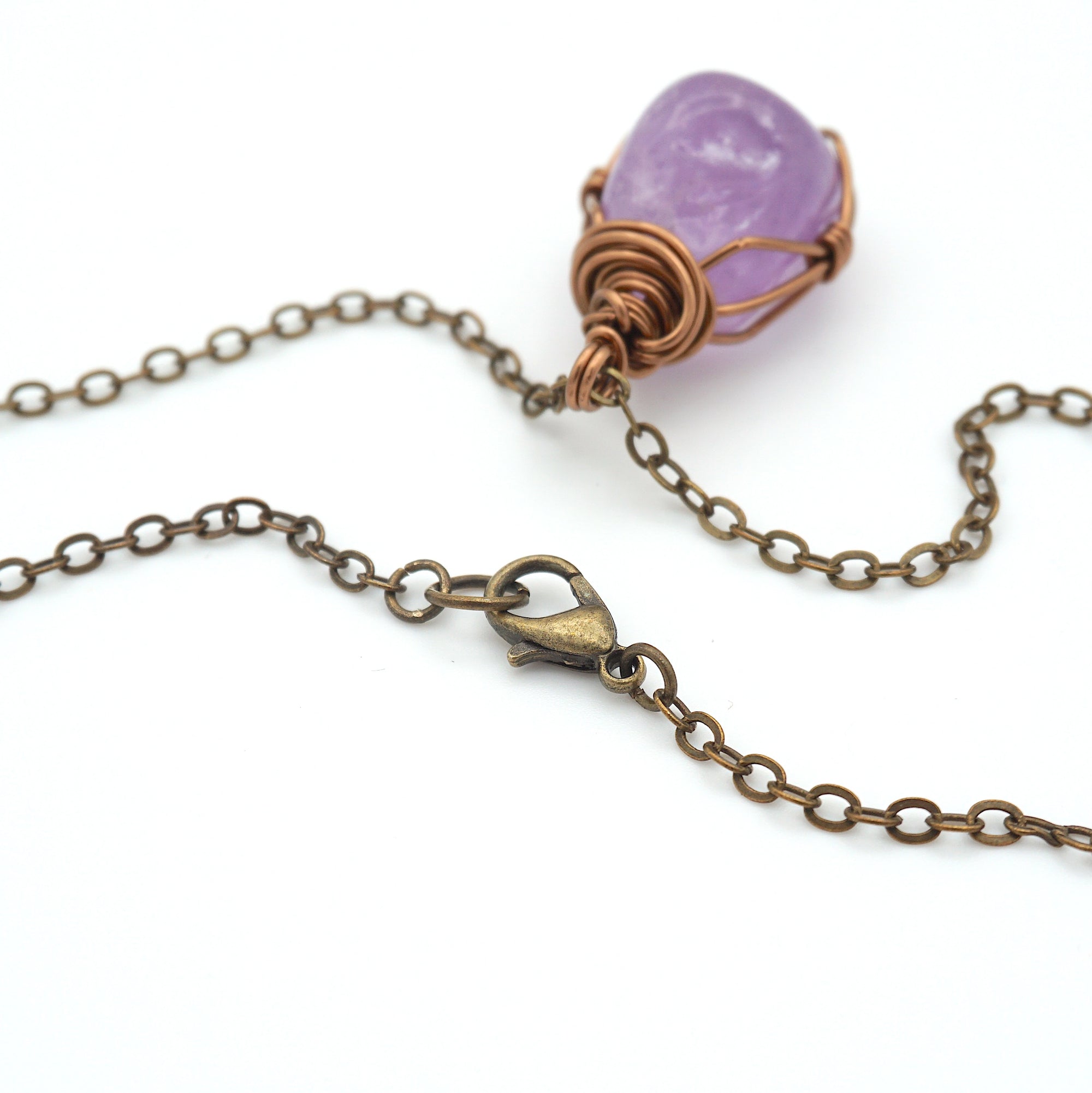 Antique bronze chain clasp closure detail with natural amethyst pendant necklace attached