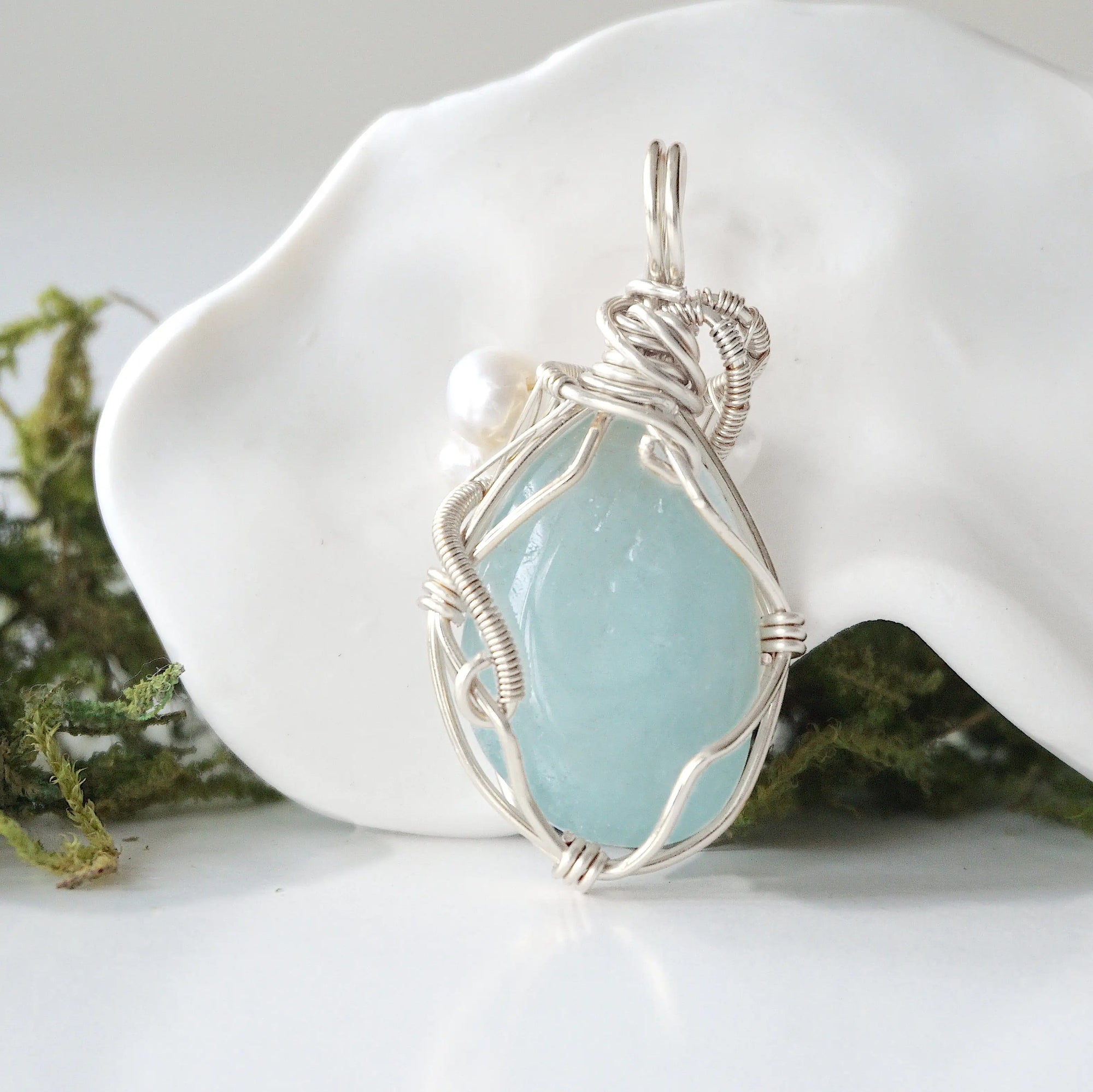 Back detail of silver wire wrapped aquamarine and freshwater pearl pendant necklace, handcrafted gemstone jewelry
