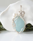 Back detail of silver wire wrapped aquamarine and freshwater pearl pendant necklace, handcrafted gemstone jewelry