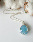Full look at raw aquamarine necklace laying flat, handcrafted sterling silver, Designs by Nature Gems