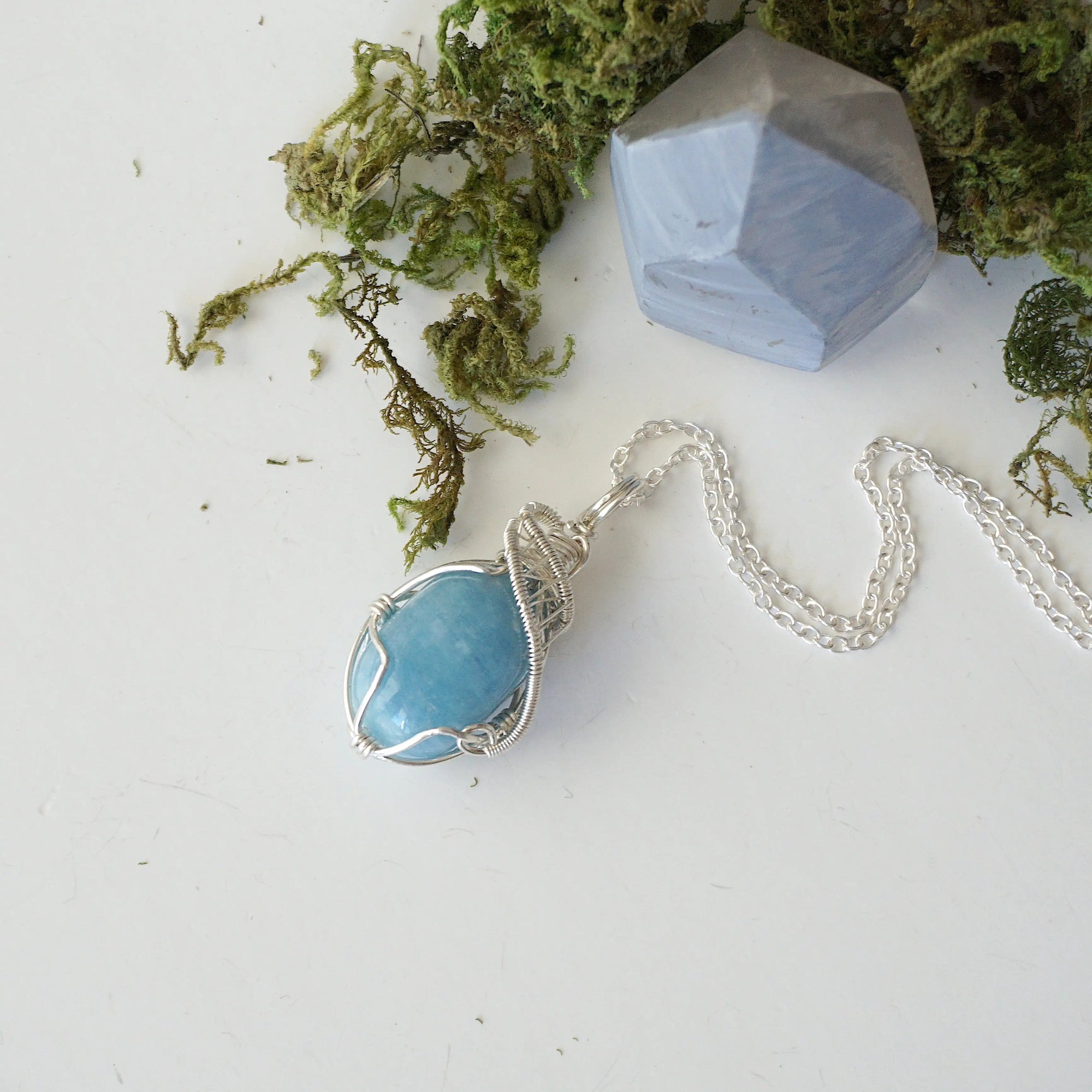 Genuine aquamarine necklace laying flat, handcrafted in sterling silver, Designs by Nature Gems
