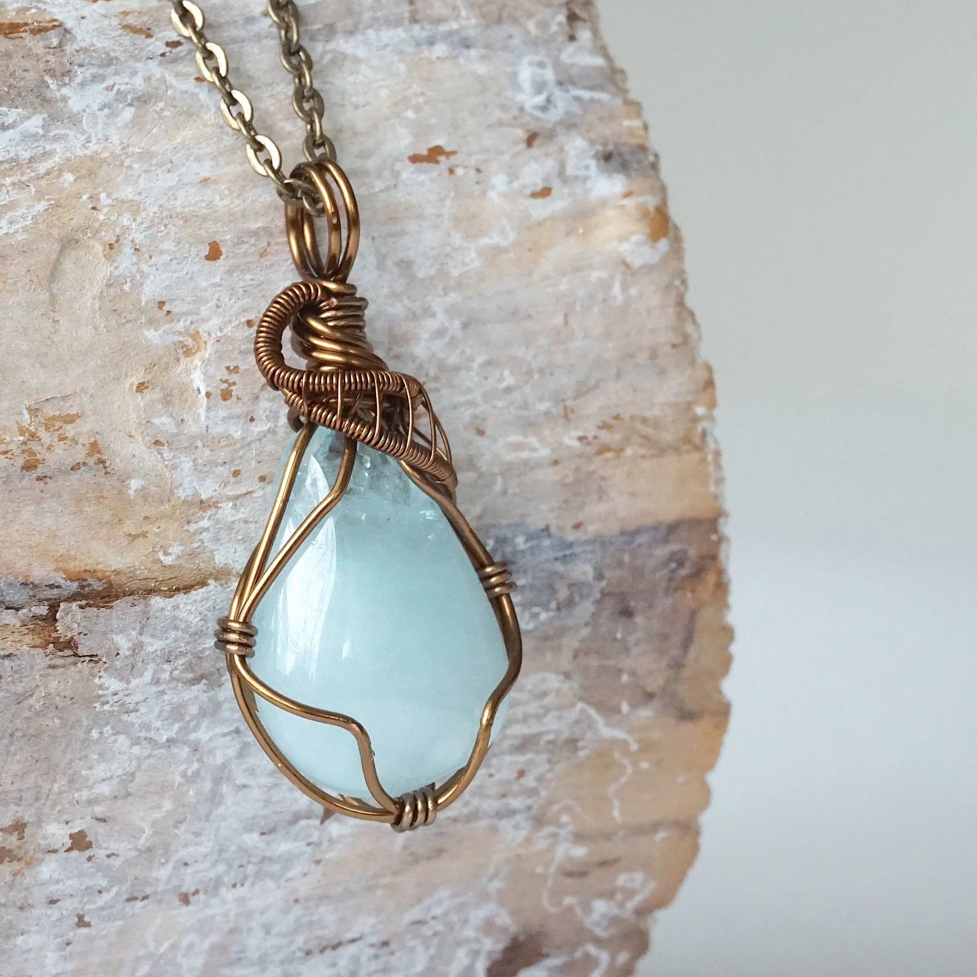 Right angle detail of genuine aquamarine necklace, wire wrapped in antique bronze copper by Designs by Nature Gems.