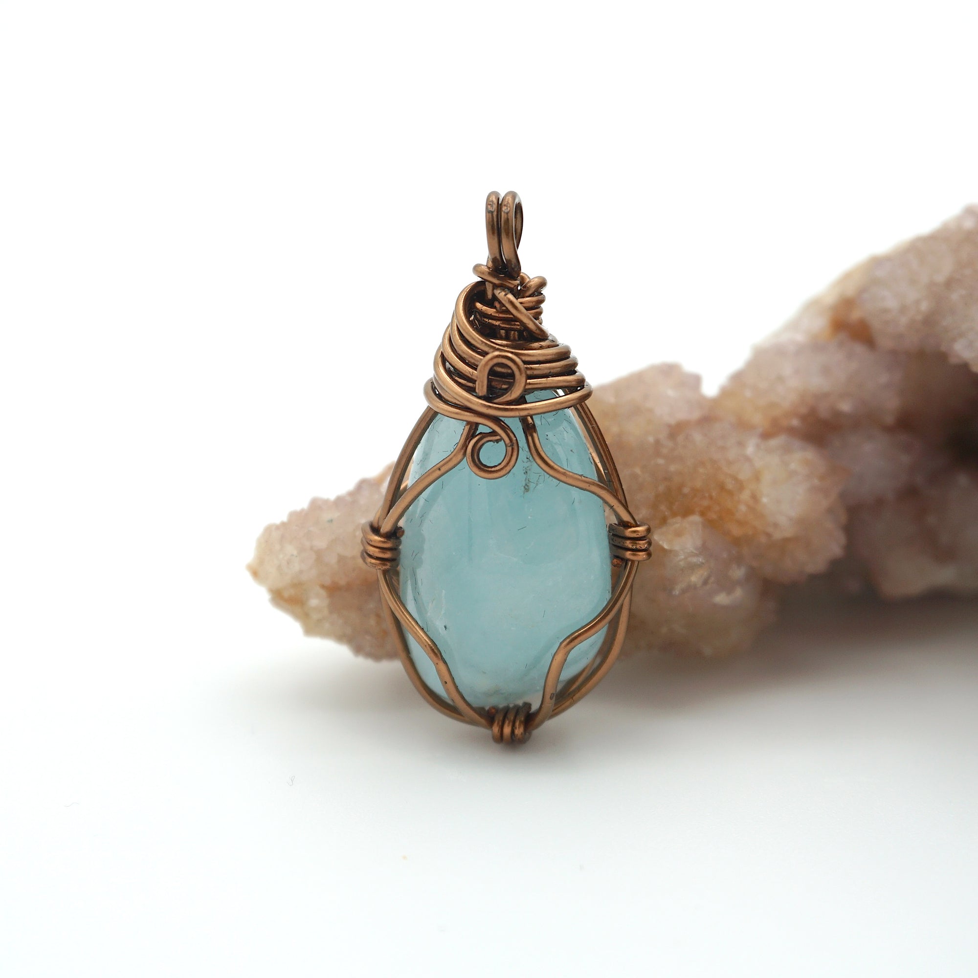 Back view of aquamarine pendant, genuine stone with handcrafted antique bronze wire