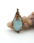 Back view of aquamarine pendant, genuine stone with handcrafted antique bronze wire