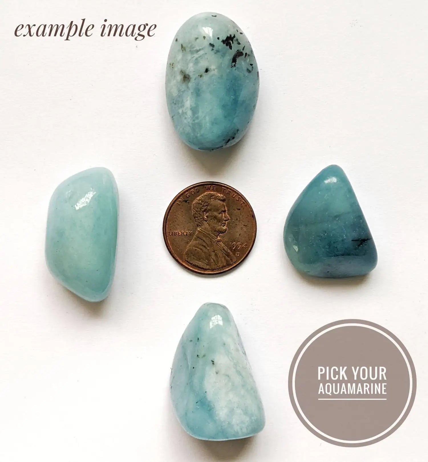 Four natural aquamarine stones showing variation in size, shape, and color for an aquamarine pendant necklace