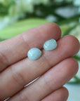 Aquamarine stud earrings in hand for size reference, genuine raw stones, sterling silver posts