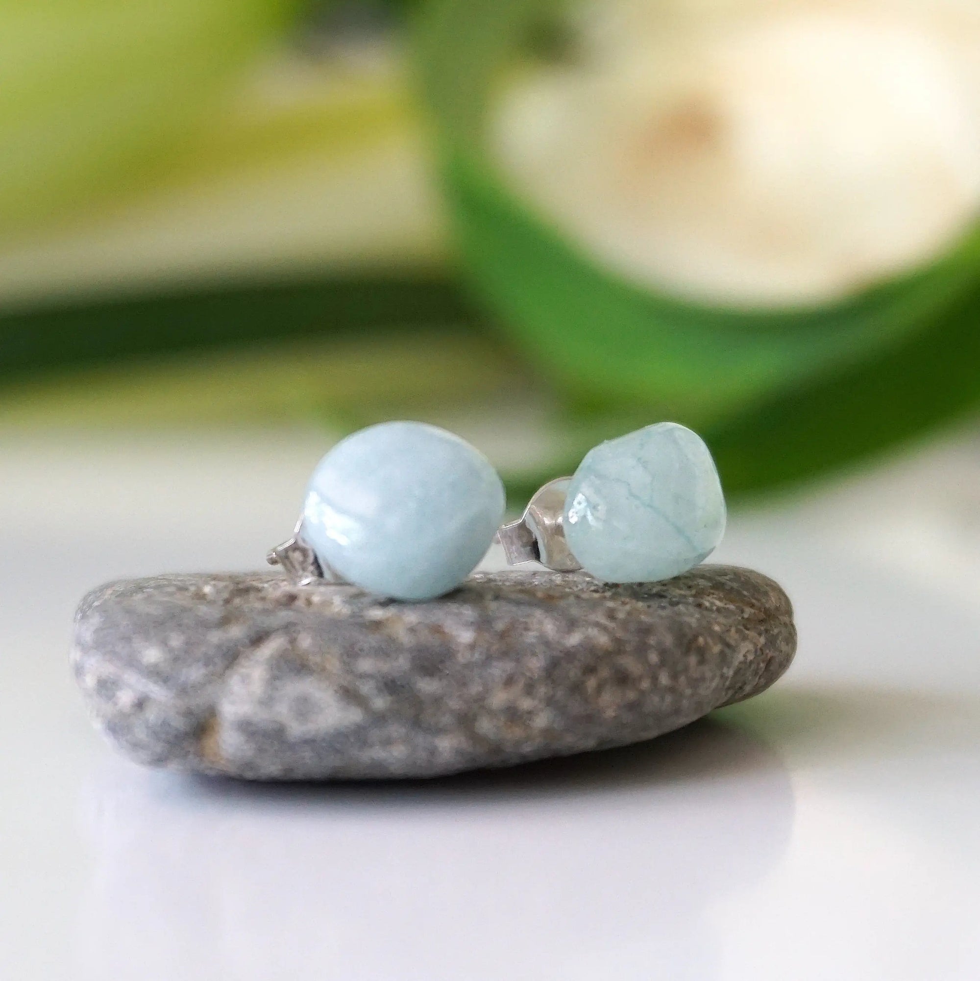 Side angle of aquamarine stud earrings, minimalist design, natural aquamarine on sterling silver