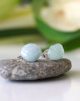 Side angle of aquamarine stud earrings, minimalist design, natural aquamarine on sterling silver