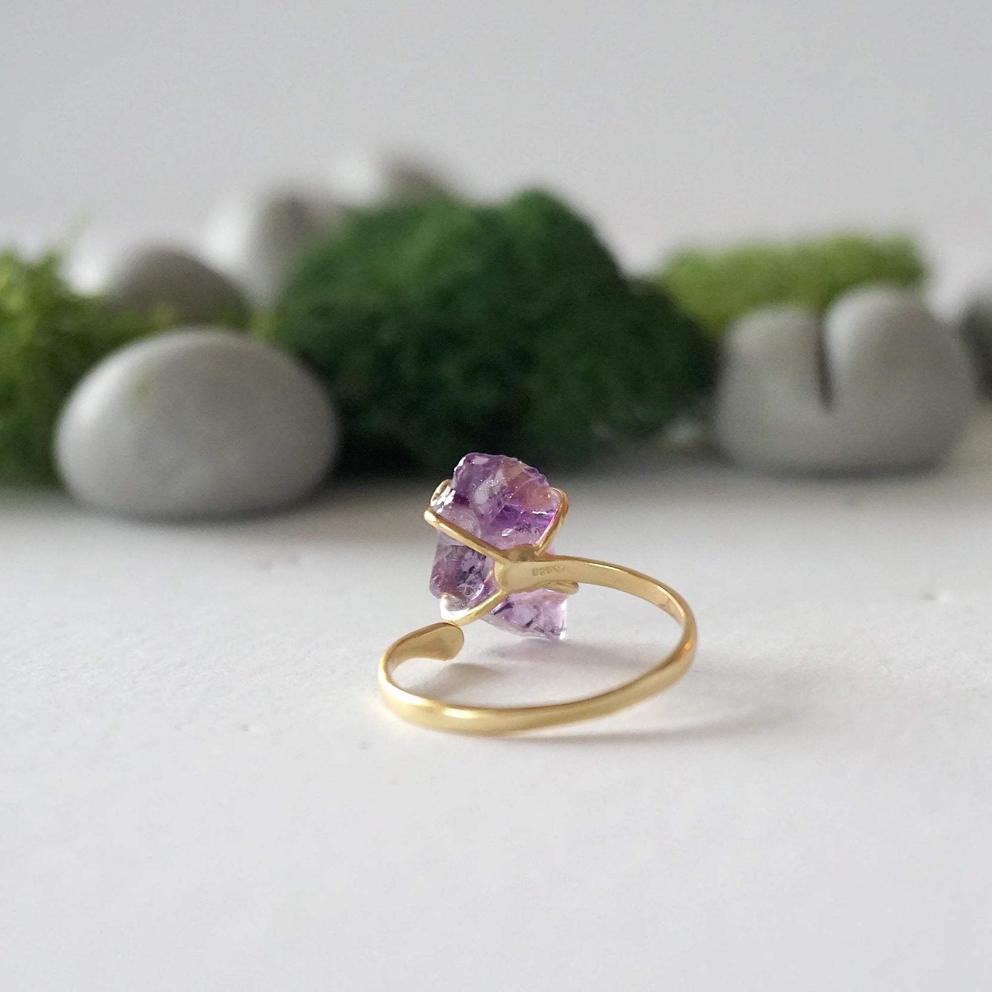 Back view of adjustable 14k gold vermeil ring with natural raw amethyst stone in claw setting