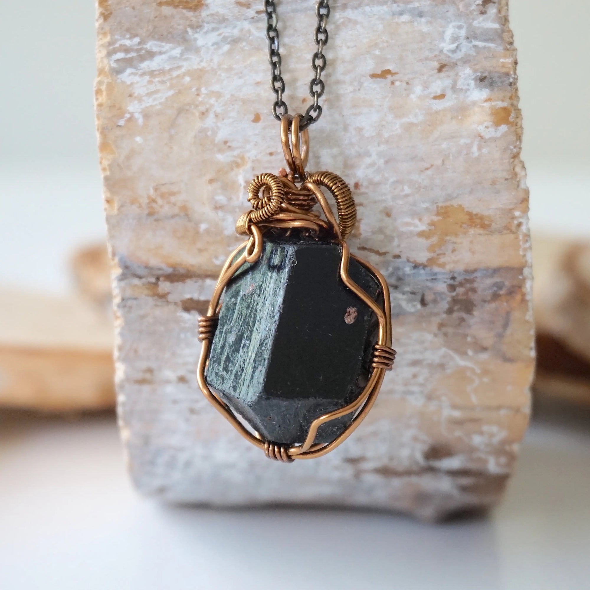 Back view of raw black tourmaline necklace on antique bronze chain, handcrafted pendant by Designs by Nature Gems.