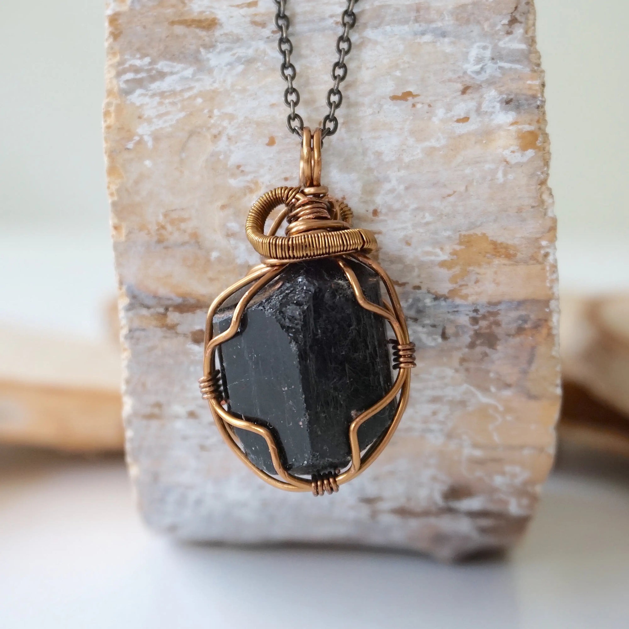 Detailed look at raw black tourmaline necklace on antique bronze chain, handcrafted crystal pendant by Designs by Nature Gems.