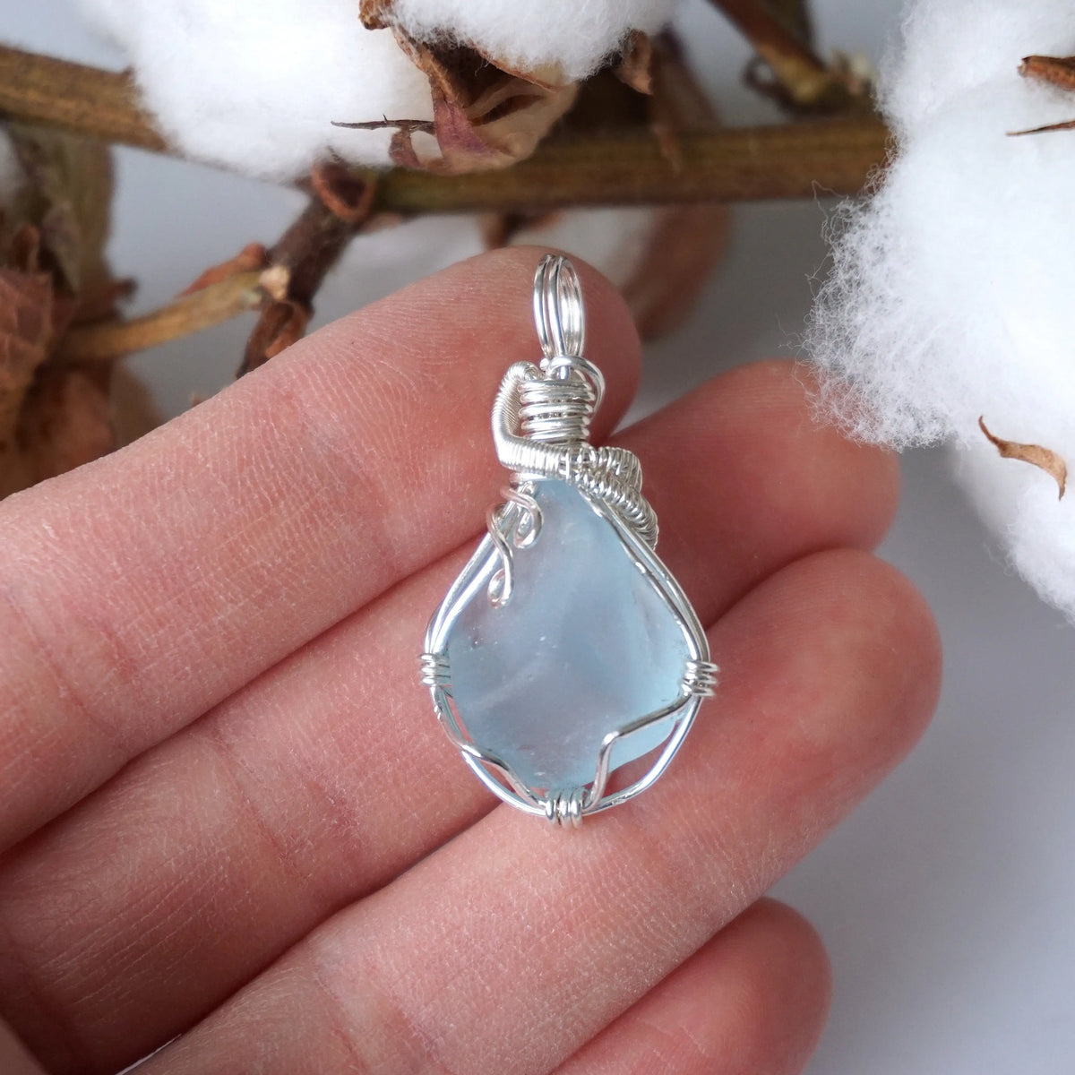 Wire-wrapped blue topaz pendant, a handmade sterling silver gemstone gift