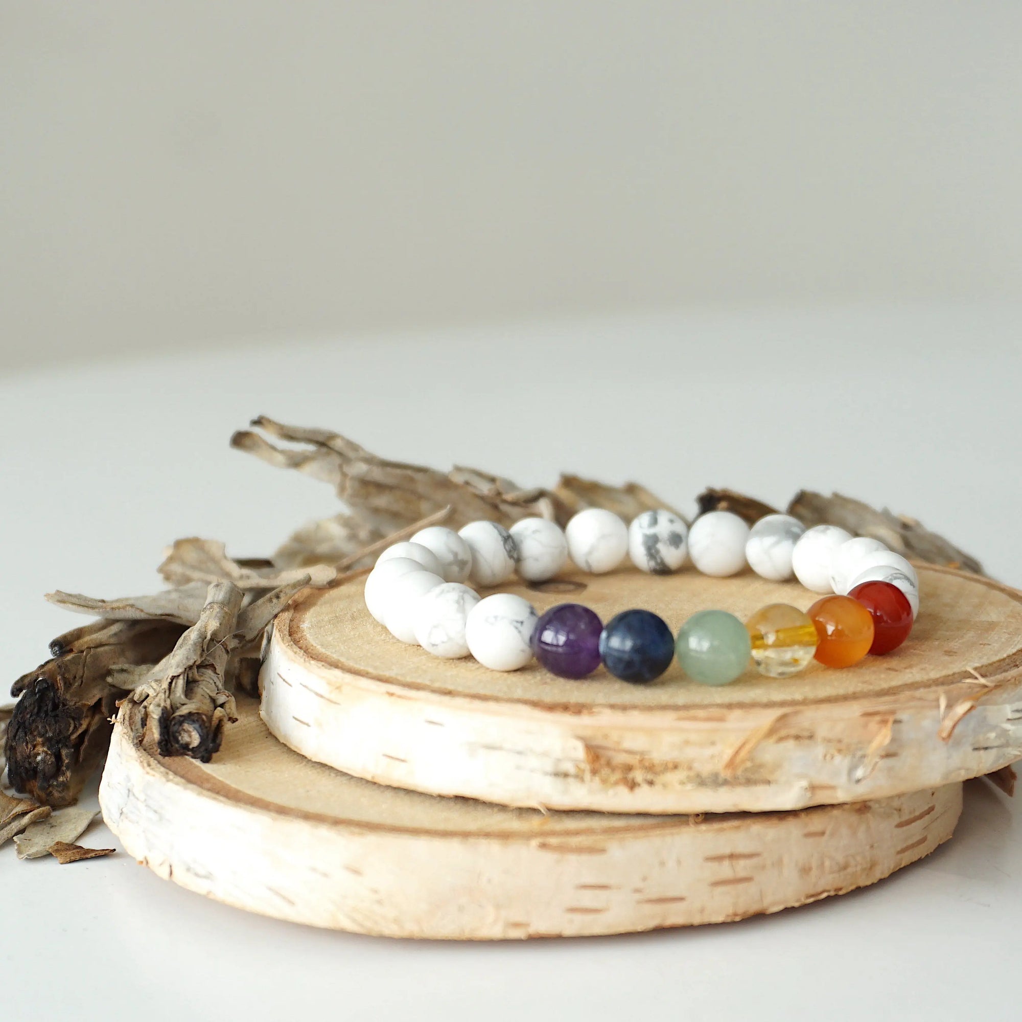 Right side view of chakra beaded stretch bracelet, natural white howlite and 7 chakra gemstone beads