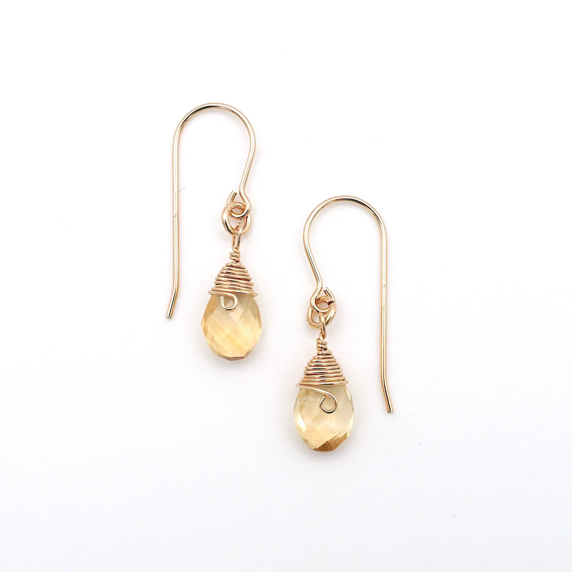 Detailed front view of citrine drop earrings, genuine faceted citrine with minimalist 14k gold filled wire wrapping, Designs by Nature Gems