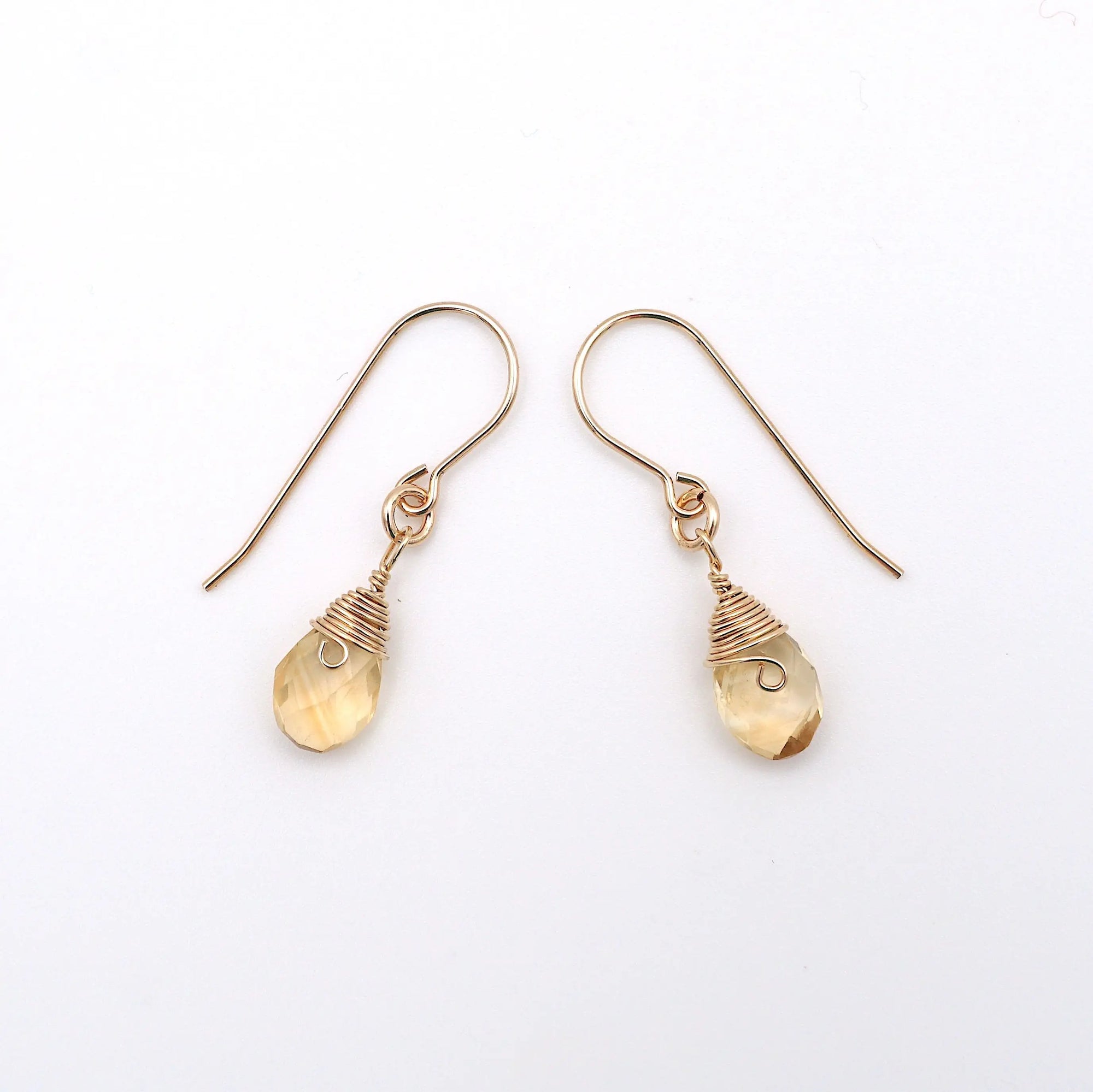 Side angle of citrine drop earrings, minimalist artisan wire wrapping, 14k gold filled