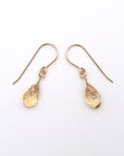 Side angle of citrine drop earrings, minimalist artisan wire wrapping, 14k gold filled
