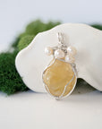 Detailed front view of silver wire wrapped citrine and freshwater pearl pendant, unique artisan necklace