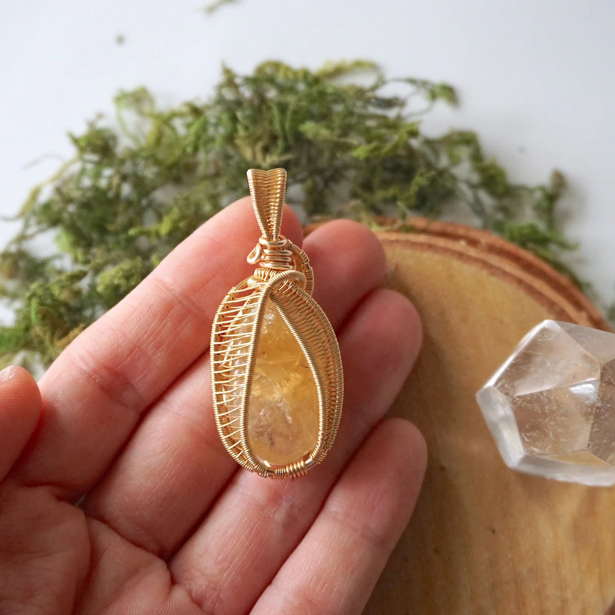 Citrine pendant gold wire wrapped held in hand showing size November birthstone necklace gift for women
