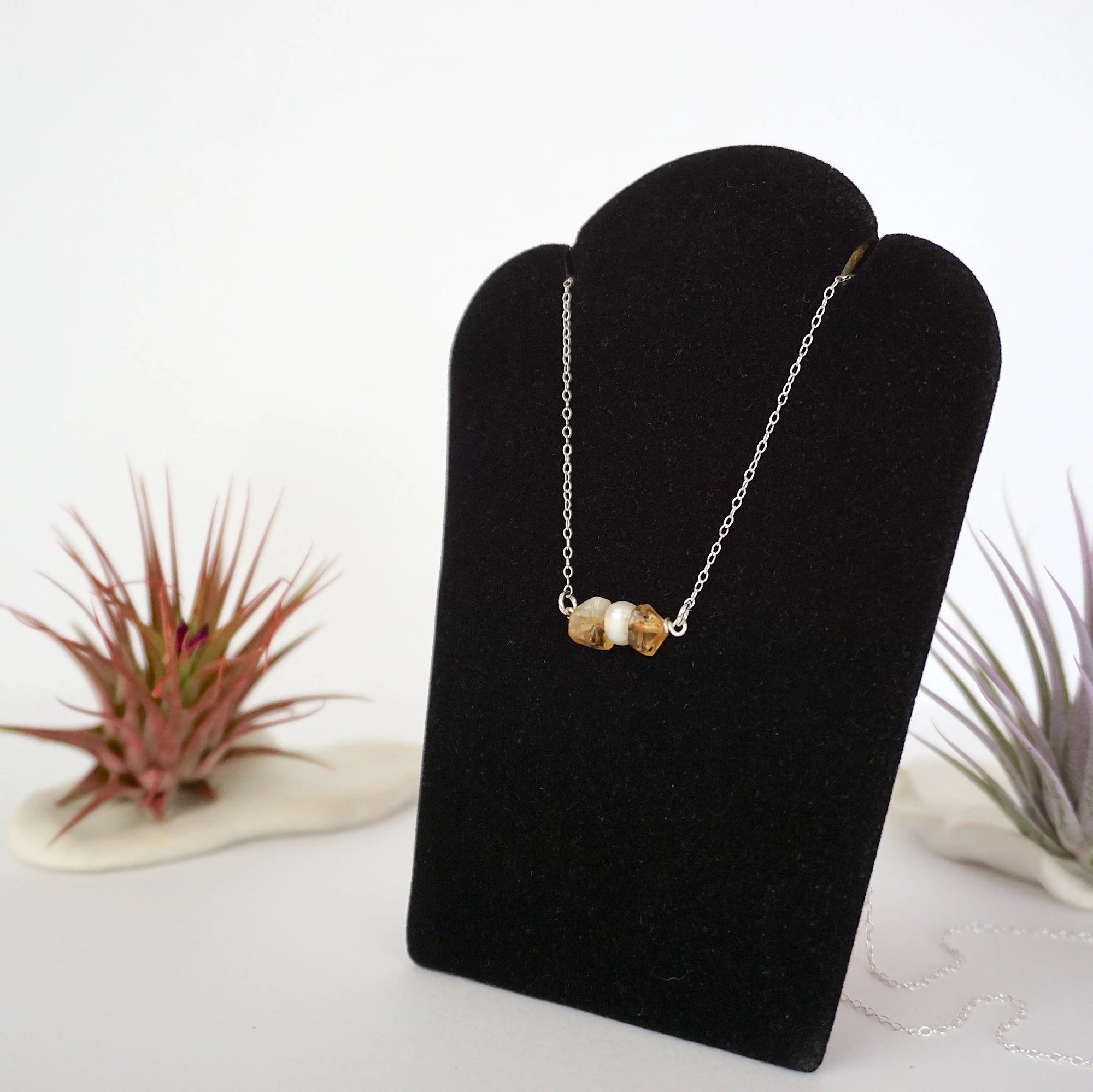 Left side angle of citrine pearl bar necklace showing horizontal pendant and sterling silver 925 chain - natural crystal freshwater pearl wire wrapped necklace full view