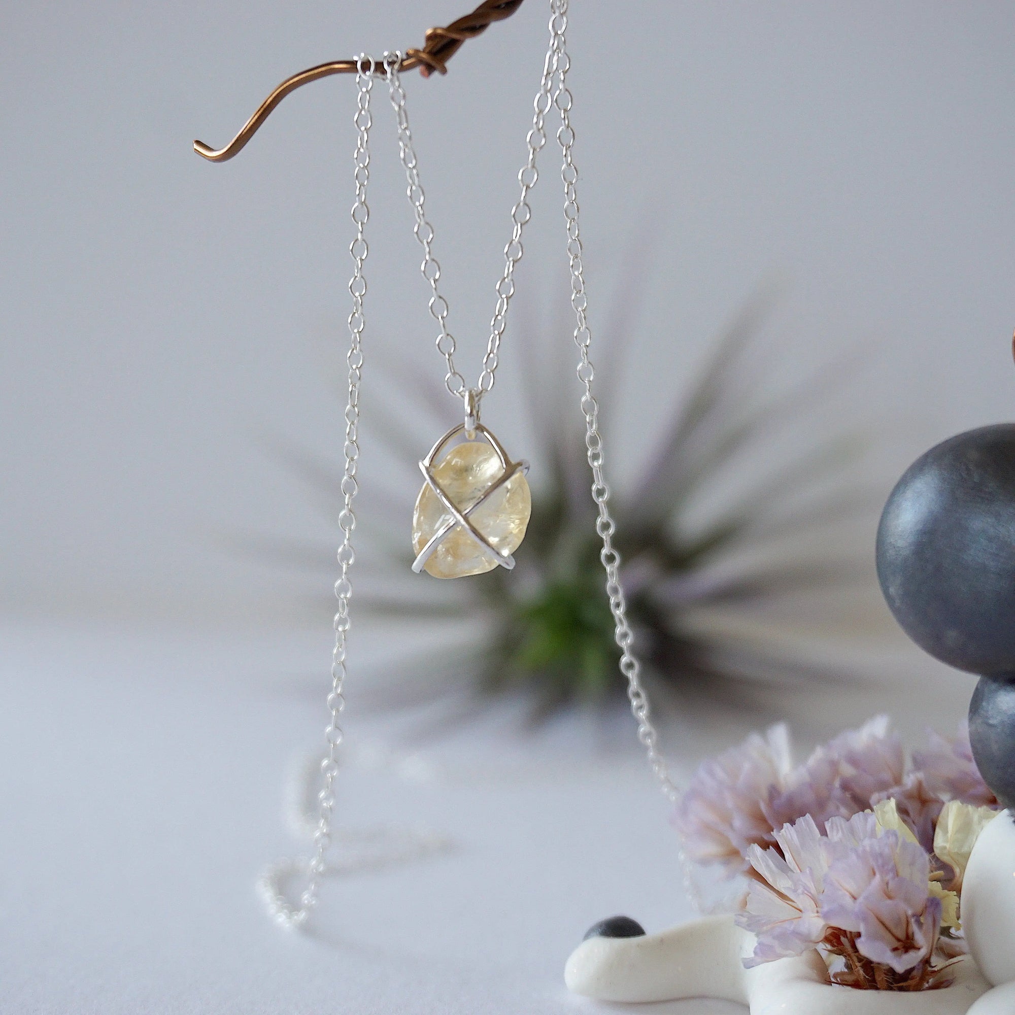 Close up back view of citrine pendant showing sterling silver 925 wire wrapping detail and craftsmanship - huggie necklace back side artisan jewelry