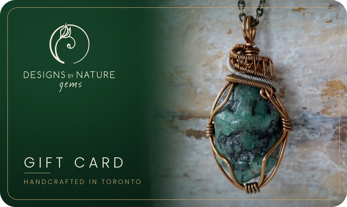 Designs by Nature Gems digital gift card with a handcrafted raw emerald pendant in antique bronze wire