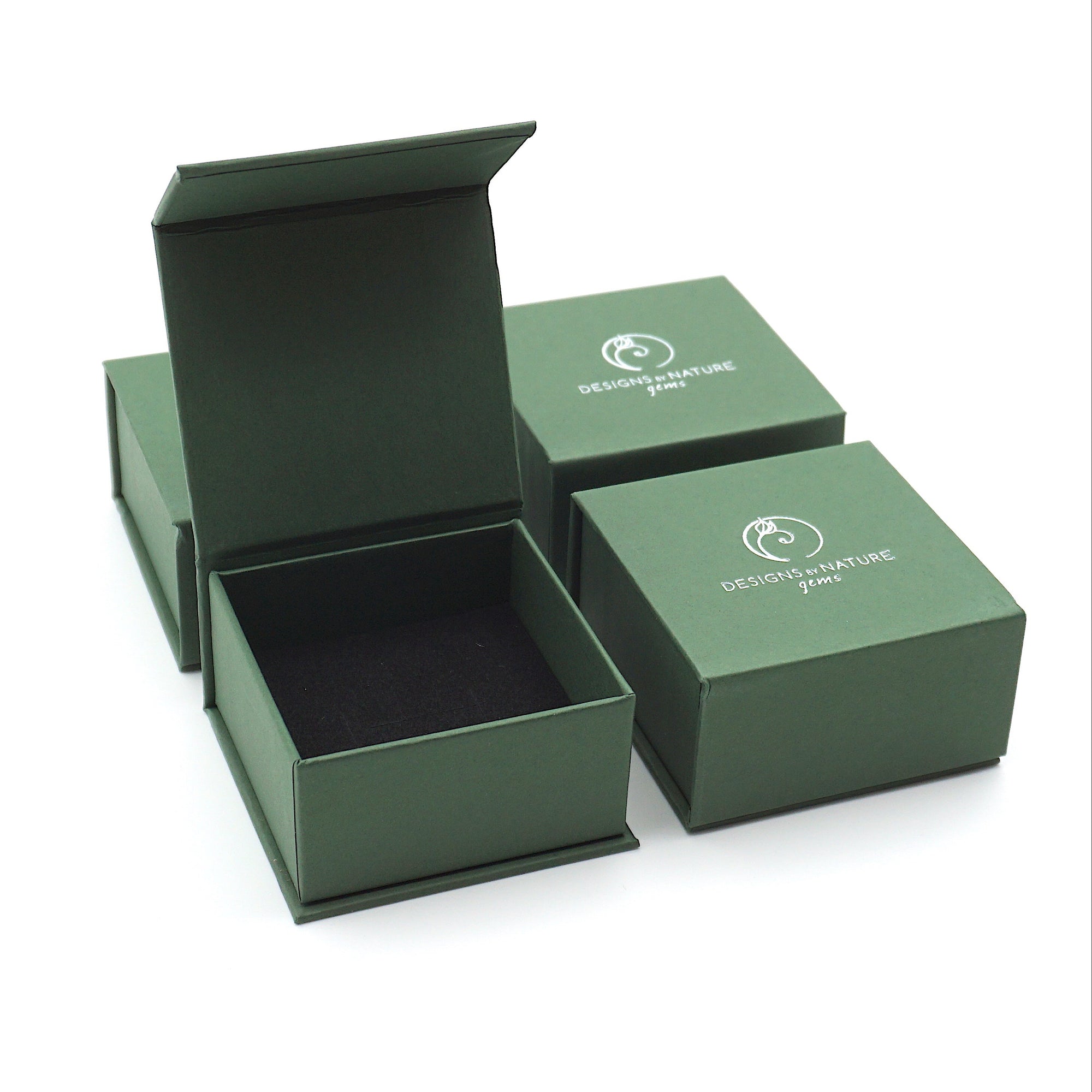 Designs by Nature Gems jewelry box packaging for handcrafted raw emerald stud earrings in sterling silver