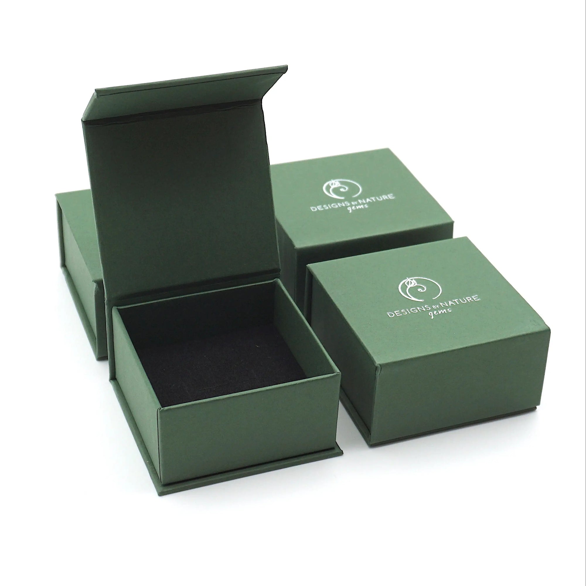 Designs by Nature Gems jewelry box packaging for handcrafted raw emerald stud earrings in sterling silver