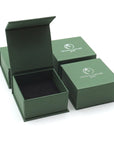 Designs by Nature Gems jewelry box packaging for handcrafted raw emerald stud earrings in sterling silver