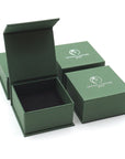 Designs by Nature Gems branded jewelry box packaging for minimalist rainbow moonstone necklace, ready for gifting.