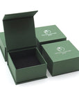 Designs by Nature Gems branded jewelry box packaging for raw rainbow moonstone stud earrings, gift-ready June birthstone jewelry.
