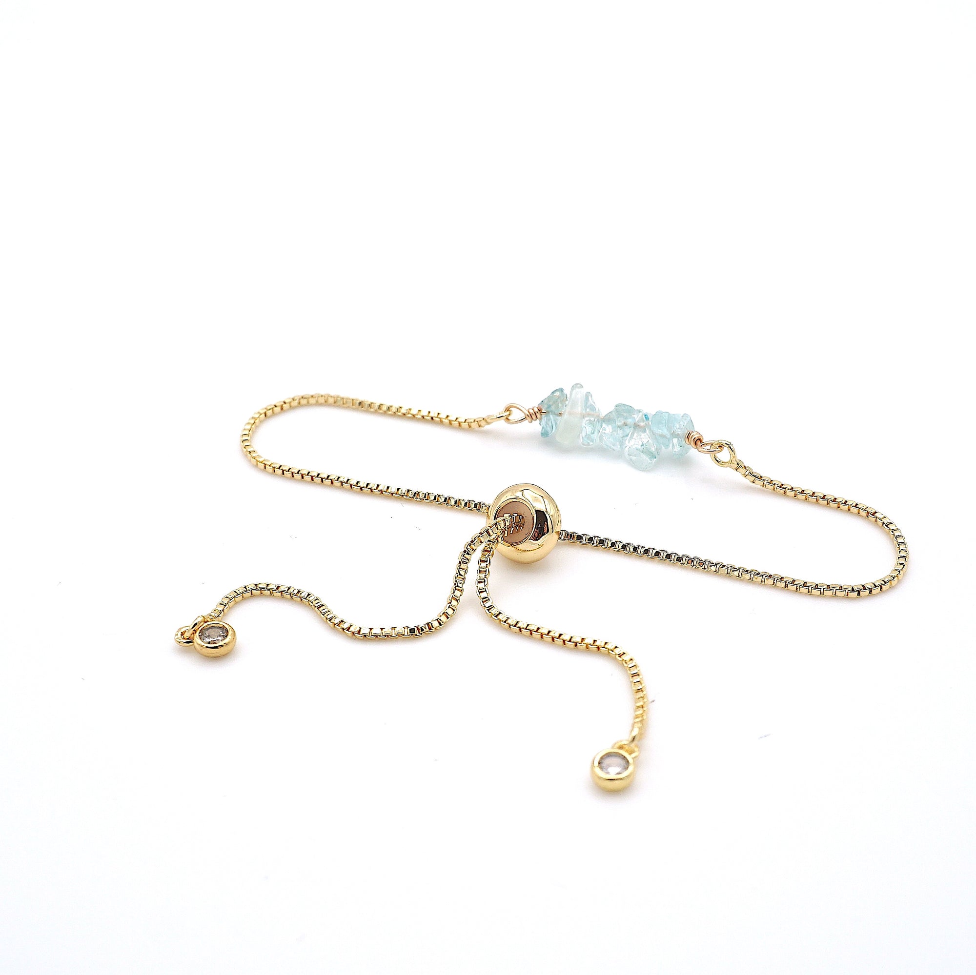 Gold plated brass slider closure on adjustable aquamarine bracelet showing easy fit mechanism - handcrafted birthstone jewelry