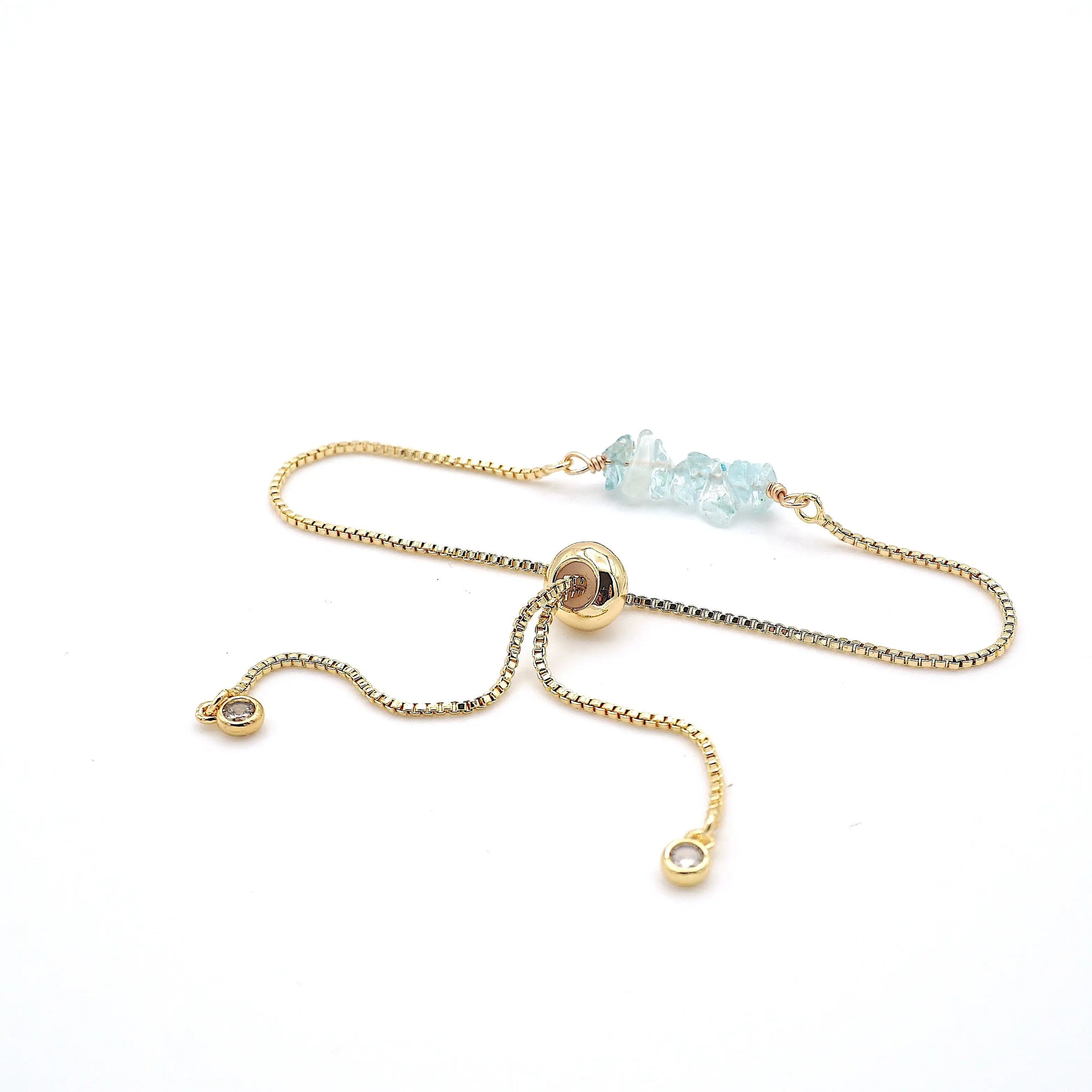 Gold plated brass slider closure on adjustable aquamarine bracelet showing easy fit mechanism - handcrafted birthstone jewelry