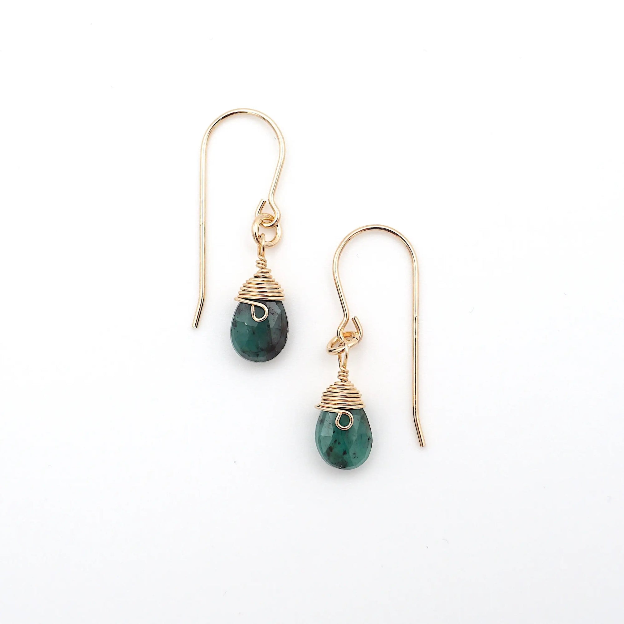 Detailed front view of emerald drop earrings, genuine faceted emerald with minimalist 14k gold filled wire wrapping, Designs by Nature Gems
