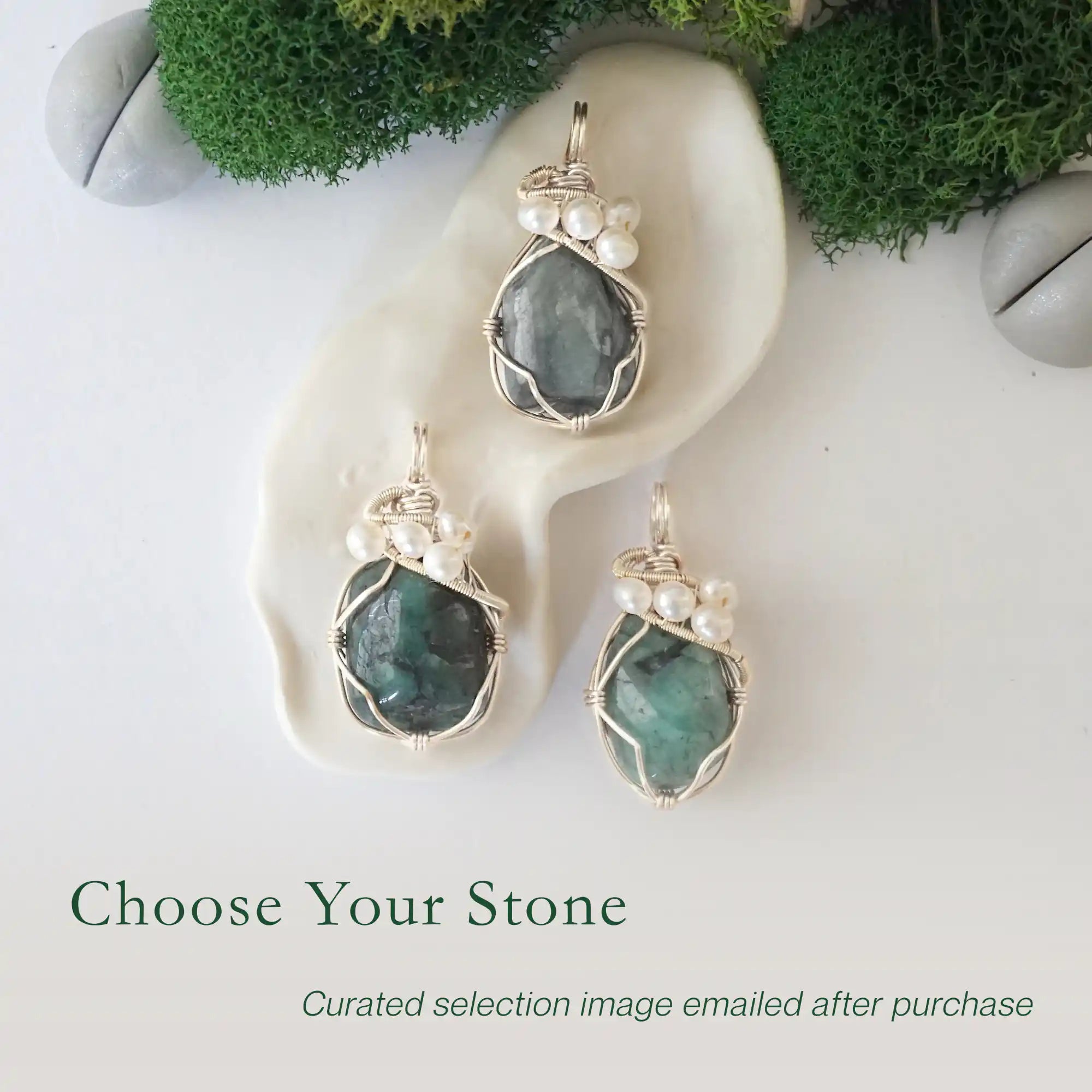 Three silver wire wrapped emerald and freshwater pearl pendants showing natural stone variation, artisan jewelry for women